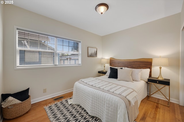 7817 N Washburne Ave, Portland, OR 97217 - bedroom featuring baseboards, wood finished floors, and visible vents