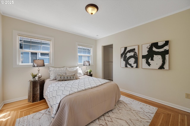 7817 N Washburne Ave, Portland, OR 97217 - bedroom with baseboards, ornamental molding, and wood finished floors