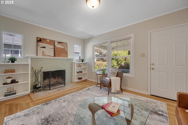 7817 N Washburne Ave, Portland, OR 97217 - living room featuring ornamental molding, wood finished floors, baseboards, a fireplace with raised hearth, and a textured ceiling