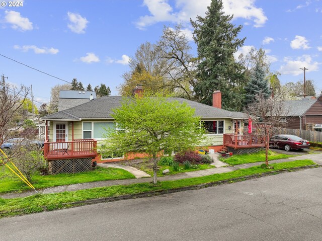 51055109 SE Tibbetts St, Portland, OR 97206 - ranch-style house with a wooden deck, a chimney, and roof with shingles