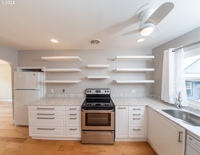 51055109 SE Tibbetts St, Portland, OR 97206 - kitchen featuring open shelves, electric range, dishwasher, white cabinets, and a sink