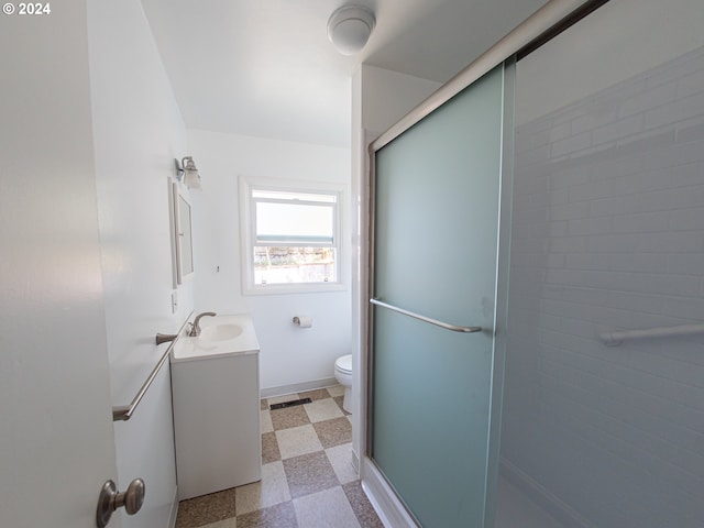 51055109 SE Tibbetts St, Portland, OR 97206 - full bathroom with vanity, toilet, a shower stall, and tile patterned floors