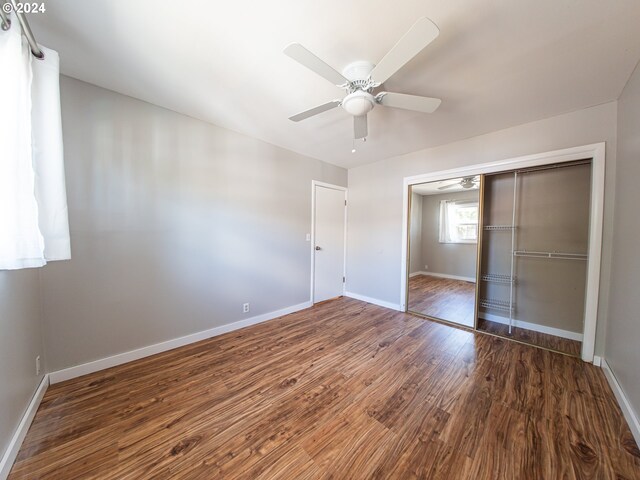 51055109 SE Tibbetts St, Portland, OR 97206 - full bath with a stall shower, hardwood / wood-style floors, and baseboards