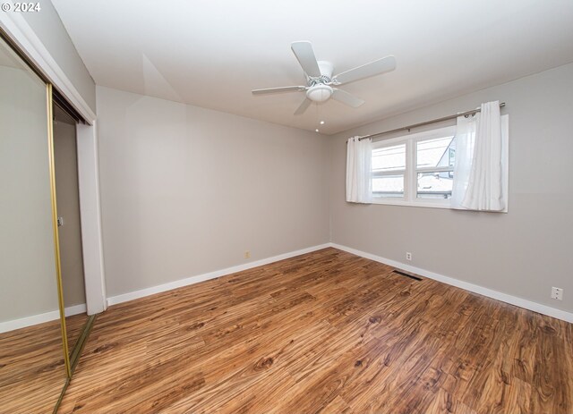 51055109 SE Tibbetts St, Portland, OR 97206 - unfurnished bedroom featuring wood finished floors, baseboards, and a closet