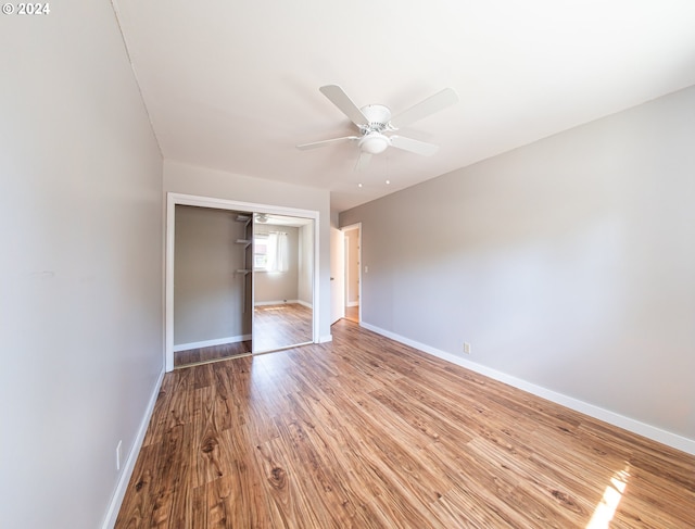 51055109 SE Tibbetts St, Portland, OR 97206 - unfurnished bedroom featuring a closet, wood finished floors, baseboards, and ceiling fan