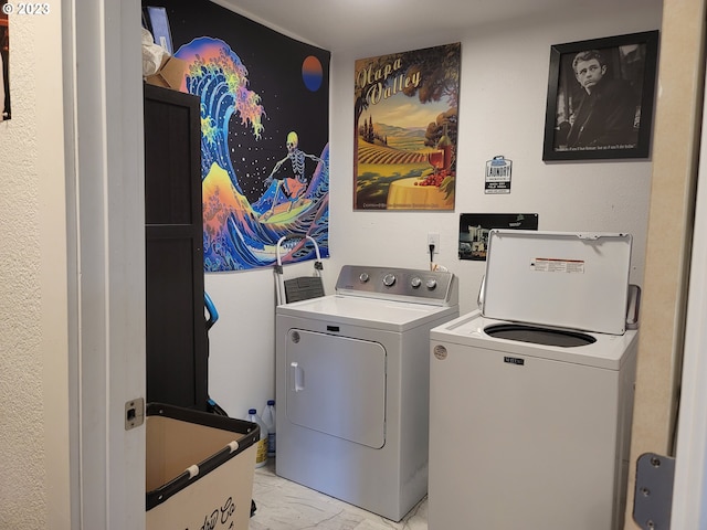 130 Aker Dr, Myrtle Creek, OR 97457 - laundry area with washer and clothes dryer and light marble finish flooring