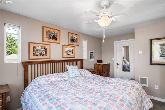 bedroom featuring baseboards, ceiling fan, and carpet flooring