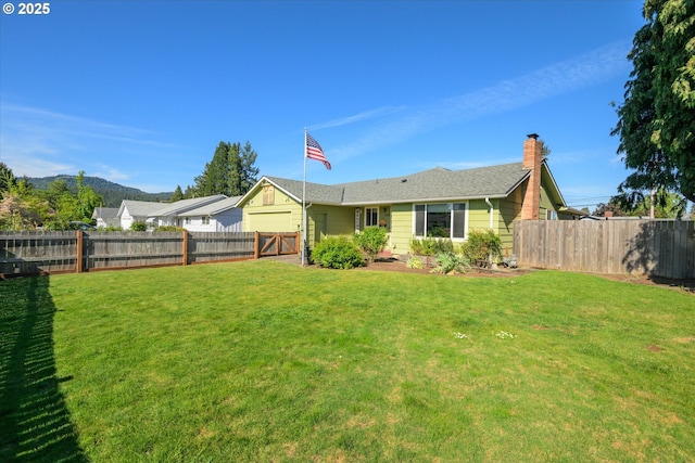 back of house featuring a chimney and a mountain view