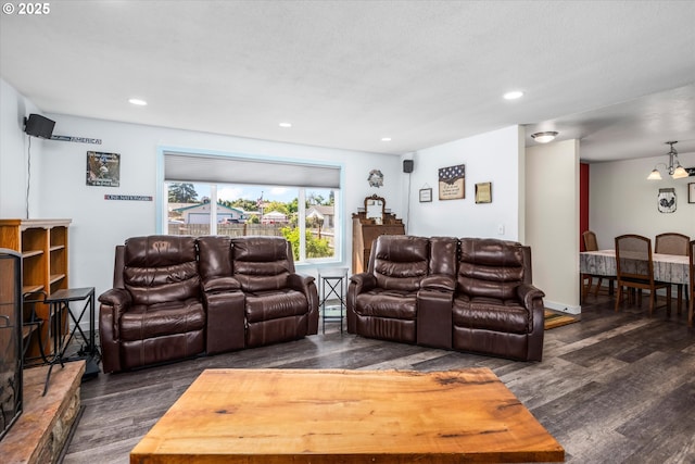 living area with wood finished floors and recessed lighting