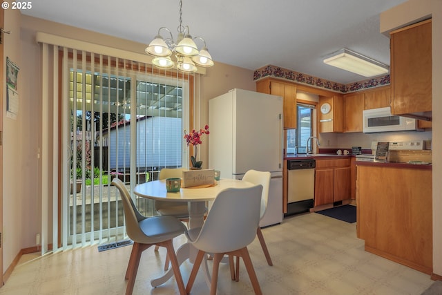 1616 N Johnson Dr, Newberg, OR 97132 - dining space featuring an inviting chandelier, light floors, and visible vents