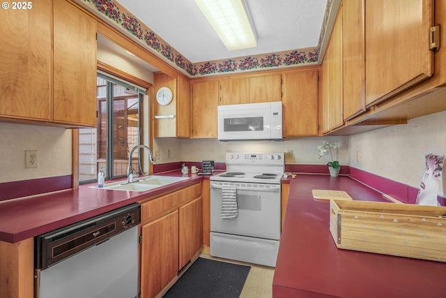 1616 N Johnson Dr, Newberg, OR 97132 - kitchen with white appliances, brown cabinets, a sink, and light floors