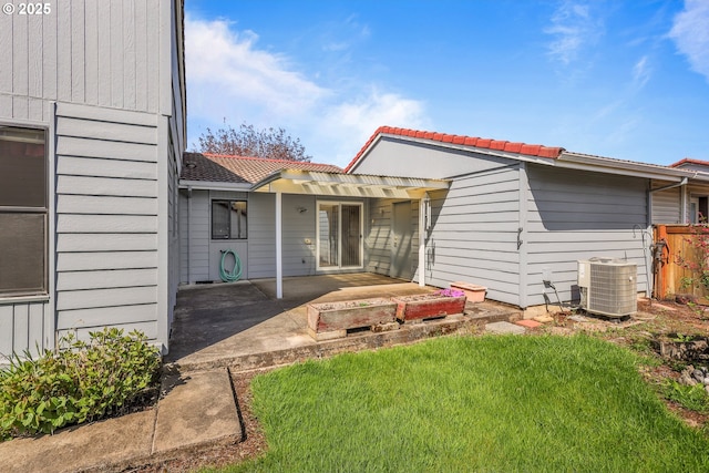 1616 N Johnson Dr, Newberg, OR 97132 - back of house with a tiled roof, a lawn, central AC unit, fence, and a patio