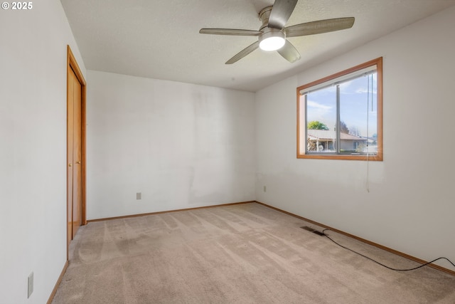 1616 N Johnson Dr, Newberg, OR 97132 - spare room featuring ceiling fan, visible vents, light carpet, and baseboards