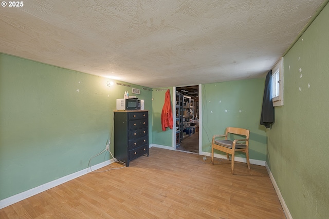 5417 NE 15th Ave, Portland, OR 97211 - sitting room with a textured ceiling and light wood-style flooring