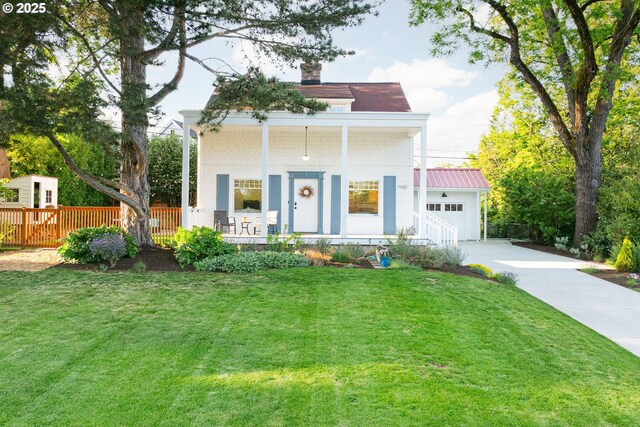 7985 SW Maple Dr, Portland, OR 97225 - greek revival inspired property with covered porch, driveway, a front lawn, a chimney, and a garage