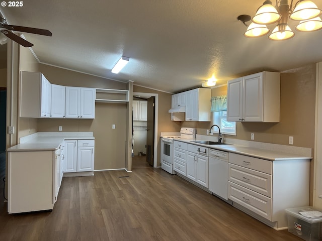 kitchen featuring lofted ceiling, white appliances, dark wood-type flooring, a sink, and white cabinetry