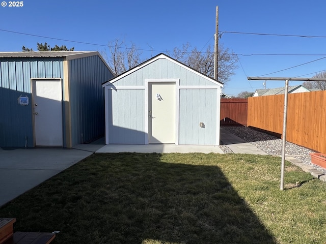 view of shed featuring a fenced backyard