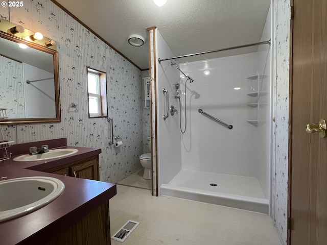 full bath with a shower, a sink, visible vents, and wallpapered walls