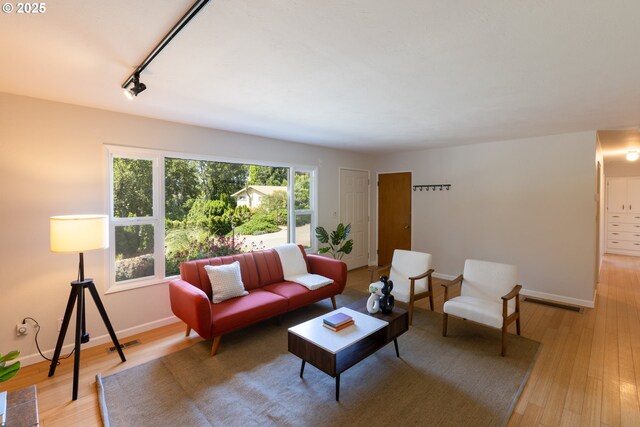 1379 Tucker Rd, Hood River, OR 97031 - living area with baseboards, light wood-style floors, and track lighting