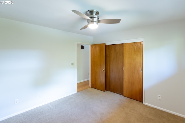 1379 Tucker Rd, Hood River, OR 97031 - unfurnished bedroom featuring light colored carpet, a closet, baseboards, and a ceiling fan