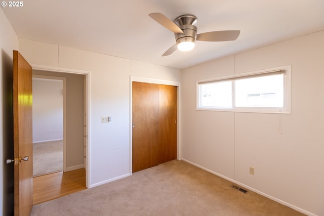 1379 Tucker Rd, Hood River, OR 97031 - unfurnished bedroom featuring carpet, a closet, baseboards, and a ceiling fan