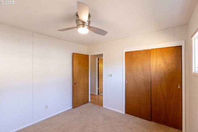 1379 Tucker Rd, Hood River, OR 97031 - unfurnished bedroom featuring light colored carpet, a closet, a ceiling fan, and baseboards