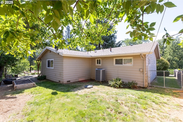 1379 Tucker Rd, Hood River, OR 97031 - rear view of property featuring central air condition unit, a vegetable garden, roof with shingles, and crawl space