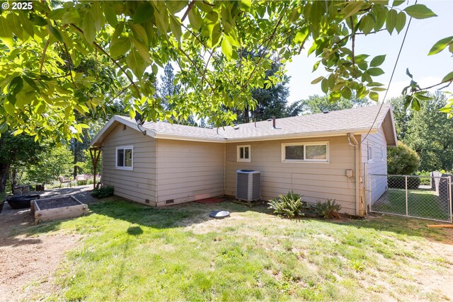 1379 Tucker Rd, Hood River, OR 97031 - rear view of property featuring central air condition unit, a vegetable garden, roof with shingles, and crawl space
