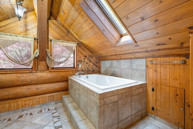 34643 Mountain View Pl NE, Albany, OR 97322 - bathroom featuring a skylight, lofted ceiling, a garden tub, wooden ceiling, and tile patterned floors