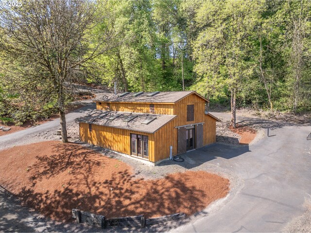 34643 Mountain View Pl NE, Albany, OR 97322 - view of front of house with a shingled roof and a wooded view