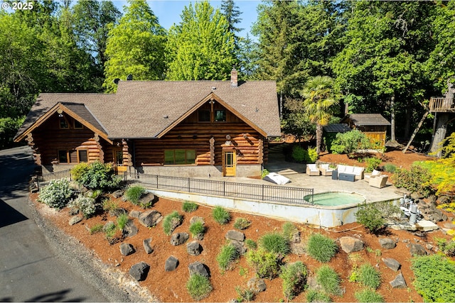 34643 Mountain View Pl NE, Albany, OR 97322 - log cabin featuring log exterior, a patio, an outdoor hangout area, and roof with shingles
