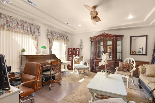 carpeted home office featuring a tray ceiling, recessed lighting, and visible vents