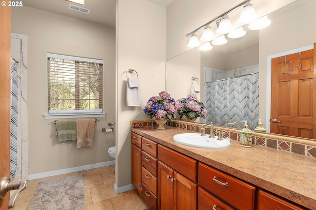 bathroom featuring visible vents, toilet, a shower with shower curtain, tile patterned flooring, and vanity