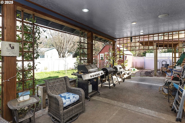 23164 N Umpqua Hwy, Idleyld Park, OR 97447 - fenced backyard with a patio, a storage unit, and grilling area