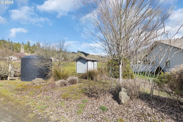 view of front of home with an outbuilding and a shed