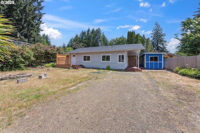 89311 Sutton Lake Dr, Florence, OR 97439 - view of front of house featuring a deck and a shed