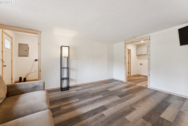 89311 Sutton Lake Dr, Florence, OR 97439 - unfurnished living room with electric panel and light wood finished floors
