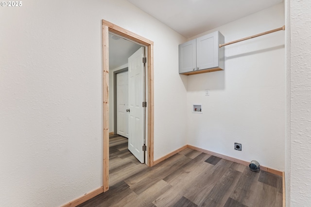 89311 Sutton Lake Dr, Florence, OR 97439 - washroom featuring cabinet space, washer hookup, hookup for an electric dryer, and wood finished floors