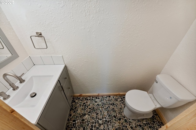 89311 Sutton Lake Dr, Florence, OR 97439 - half bathroom with stone finish flooring and vanity