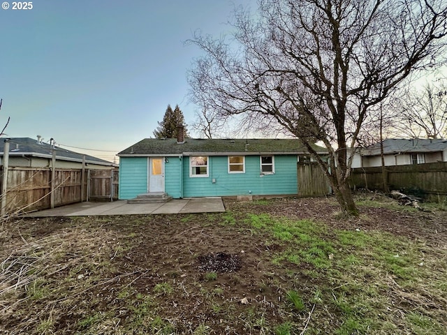 rear view of house with a patio