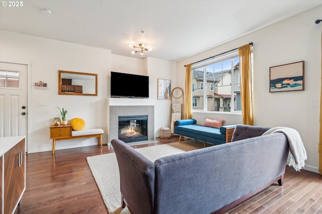 680 NW Falling Waters Ln Unit 105, Portland, OR 97229 - living room with dark wood-style floors and a tiled fireplace