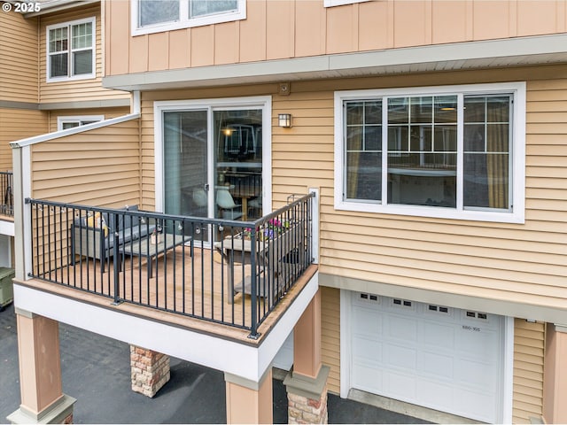 680 NW Falling Waters Ln Unit 105, Portland, OR 97229 - entrance to property featuring a garage and board and batten siding