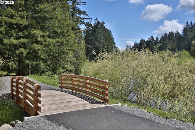 680 NW Falling Waters Ln Unit 105, Portland, OR 97229 - gate featuring a wooded view