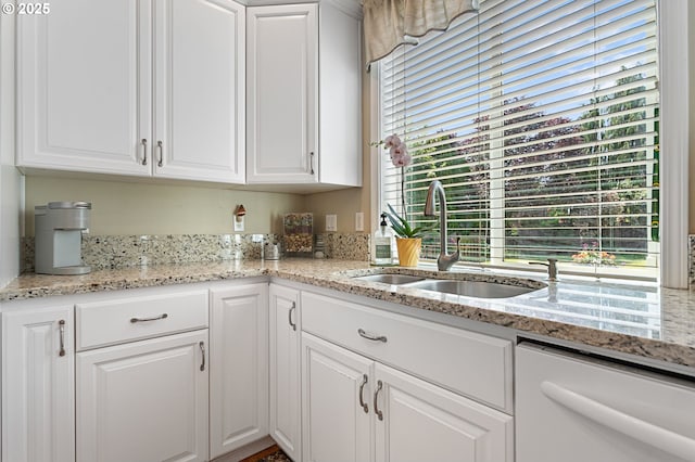 16295 NW Energia St, Portland, OR 97229 - kitchen featuring white dishwasher, white cabinets, and light stone countertops