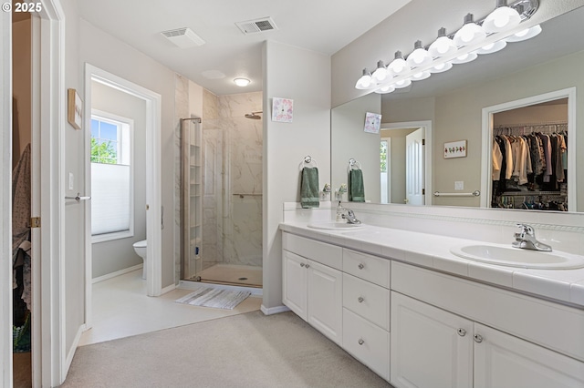 16295 NW Energia St, Portland, OR 97229 - full bath featuring a shower stall, double vanity, and a spacious closet