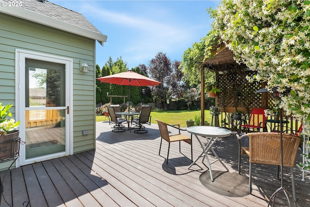 16295 NW Energia St, Portland, OR 97229 - wooden terrace featuring outdoor dining area and a yard