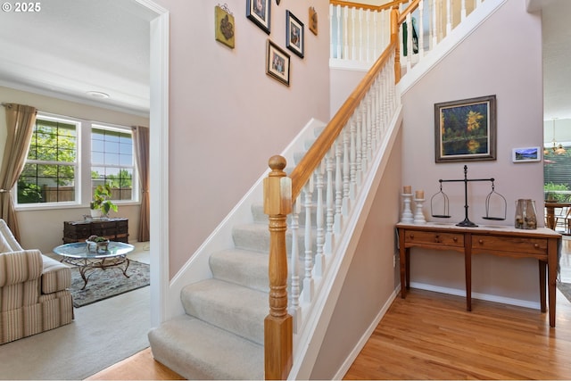 16295 NW Energia St, Portland, OR 97229 - stairway with wood finished floors and baseboards