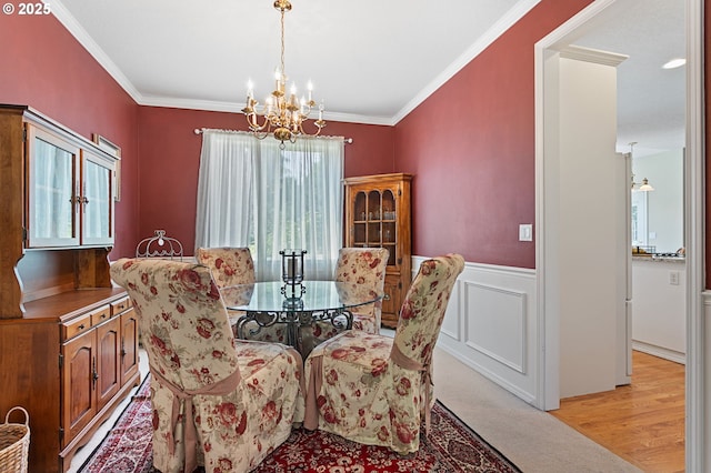 16295 NW Energia St, Portland, OR 97229 - dining area with a chandelier, ornamental molding, and a wainscoted wall