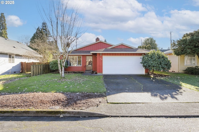 ranch-style home with a garage and a front lawn