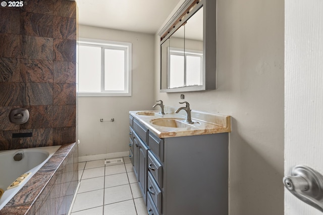 1203 NE 190th Pl, Portland, OR 97230 - bathroom featuring plenty of natural light, baseboards, a relaxing tiled tub, and double vanity